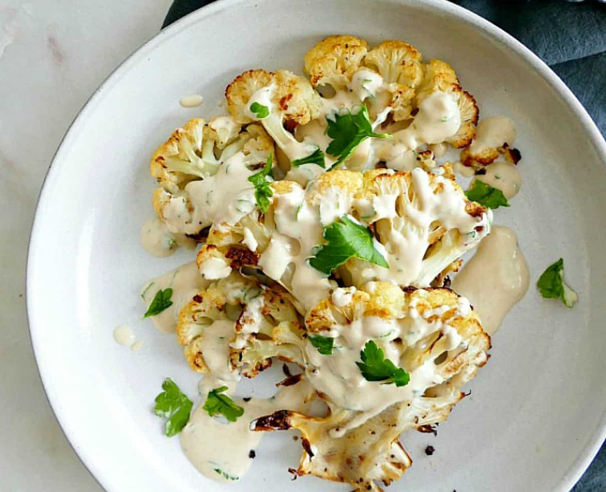 Vegan Roasted Cauliflower Steaks with Lemon Tahini Sauce